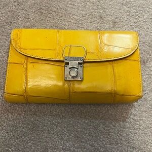 Dooney and Bourke Wallet. Never used. Mustard yellow